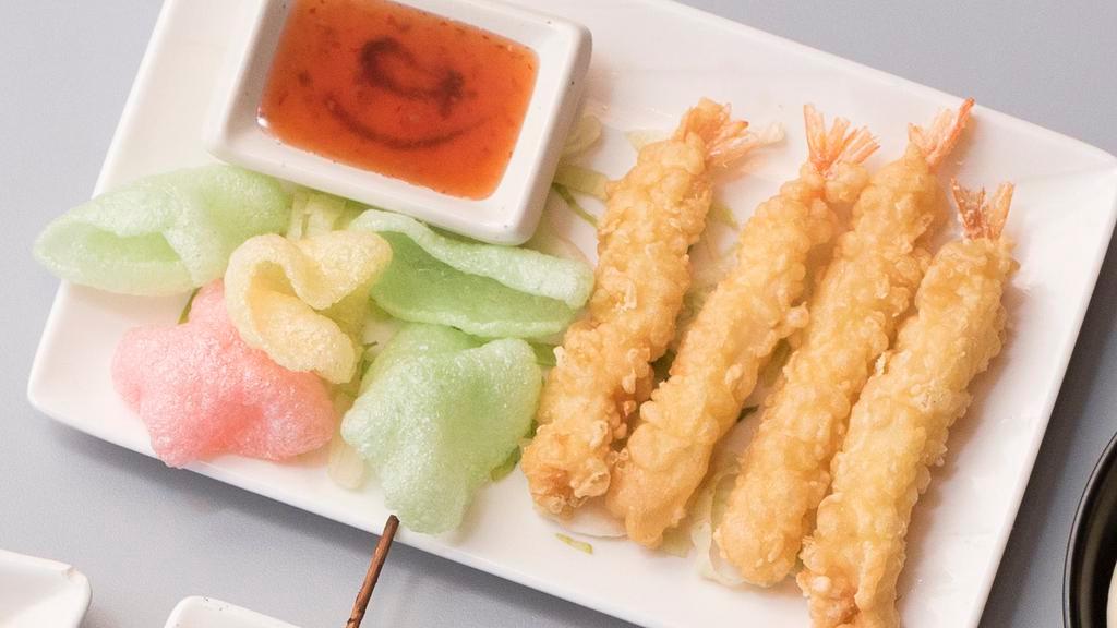 Shrimp Tempura Roll · Crispy tempura shrimp, avocado, cucumber, smelt roe, and sesame seeds.