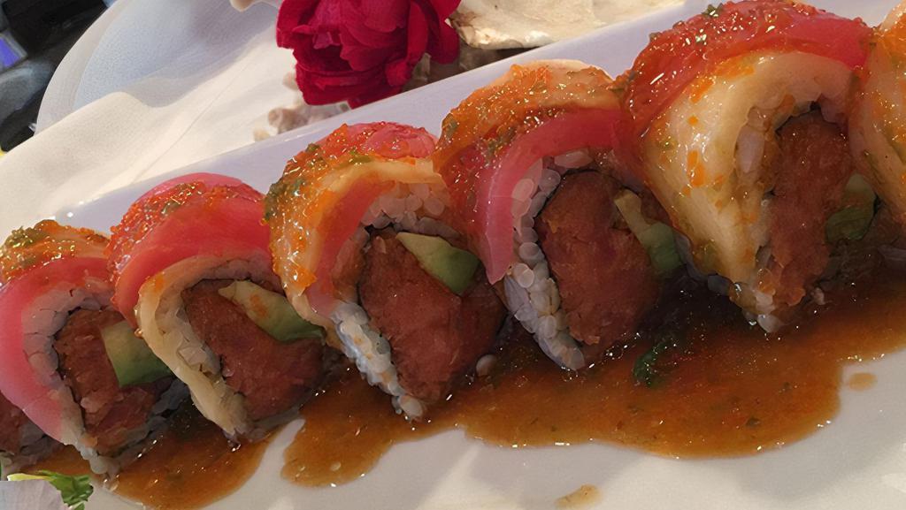Pink Hawaii Roll · Spicy tuna inside, fresh tuna, and escolar topped with chef's special sauce. Raw.