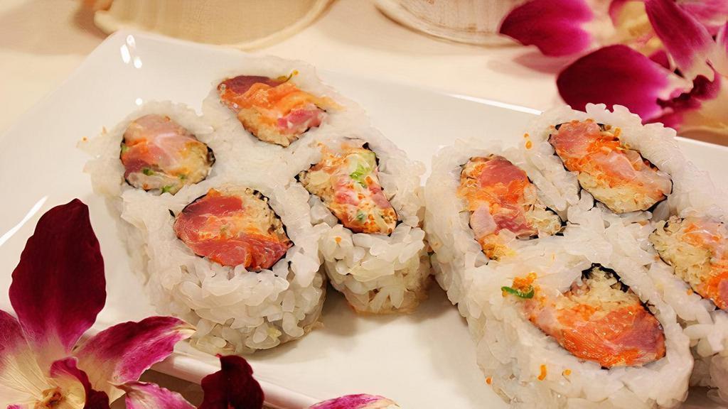 Fire Cracker Roll · Tuna, fresh salmon, and yellowtail mixed together with green onion, wasabi, and tempura batter. Raw.