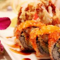 Soft-Shell Crab Roll · Deep-fried soft-shell crab, green onion, and cucumber inside with smelt roe outside. Topped ...