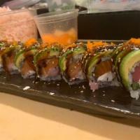 Samurai Roll · Tuna, fresh salmon, yellowtail, cream cheese, and asparagus inside topped with sliced avocad...
