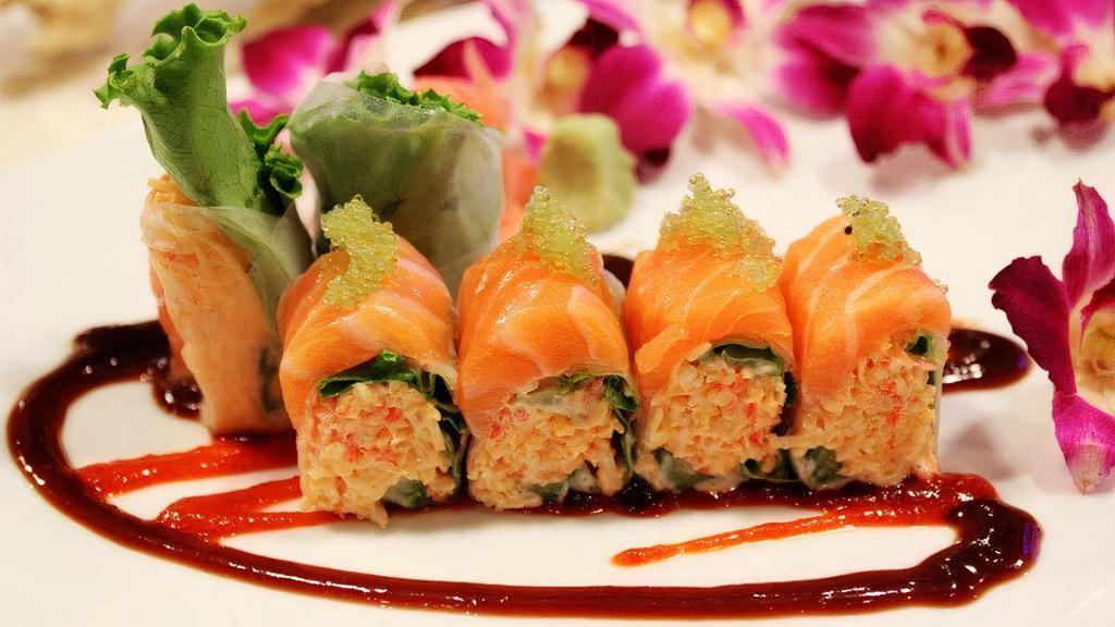 Phoenix Roll · Snow crab, asparagus, and spicy mayo wrapped in Rice paper and topped with fresh salmon and wasabi roe. Served with spicy hoisin sauce on the side with rice. Raw.