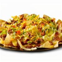 Beef Nacho Salad · Beef, chips, lettuce, chili sauce, queso, tomato.