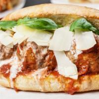 Meatball Parm Sub · Slow-cooked turkey meatballs topped with tomato sauce and cheese melt on a toasted garlic bu...