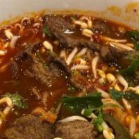 Pho Num Thok · Rice noodles, charbroiled beef and onions with house special broth sprinkle with scallion, c...