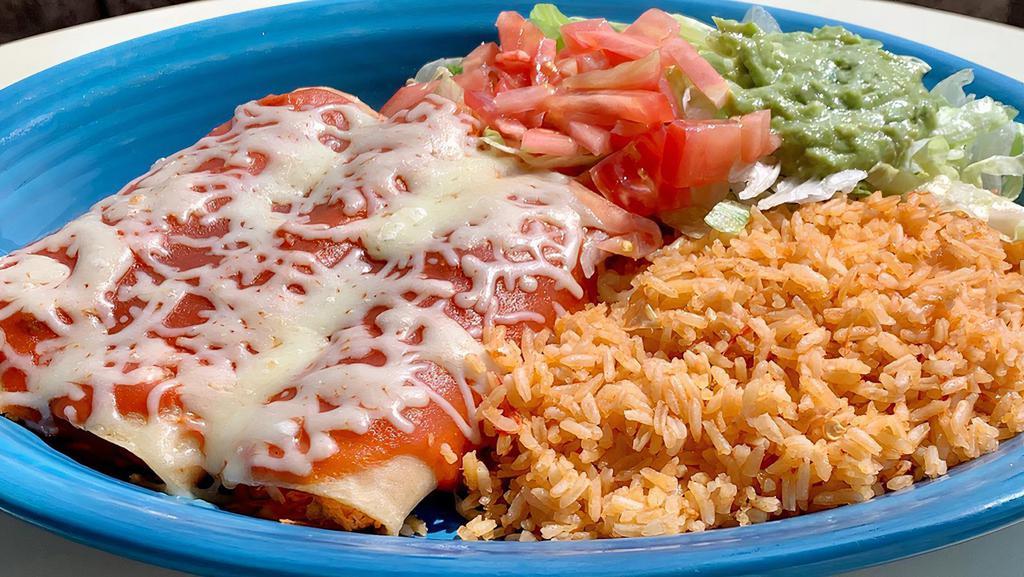 Yolanda'S · Three Shredded chicken enchiladas, topped with enchilada sauce. Served with rice and guacamole salad.