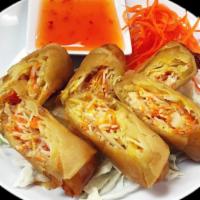 Spring Rolls · Rice paper filled with carrots, cabbage, onions, clear noodles and pork rolled into a cylind...