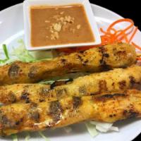 Chicken Satay · Three kabob style skewers loaded with chicken, seasoned with lemon grass, curry powder and l...