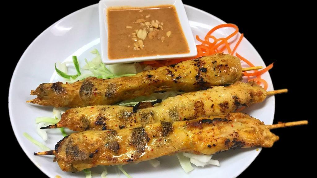 Chicken Satay · Three kabob style skewers loaded with chicken, seasoned with lemon grass, curry powder and lime leaf marinade.