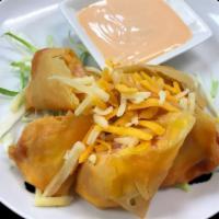 Crispy Bacon · Bacon and cheese wrapped in spring roll skin, deep fried. Served with a special creamy white...