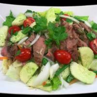 Thai Spicy Beef Salad · Slices of grilled tender beef dressed with Thai spicy lime sauce, garlic, chillies, cucumber...