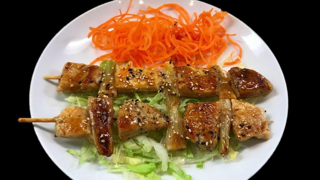Chicken Yakitori · Diced chicken skewered with scallions, grilled and served with a side of teriyaki sauce.