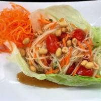 Papaya Salad (Som Tum) · Shredded green papaya, carrots, tomatoes and peanuts tossed in Thai special lime juice with ...