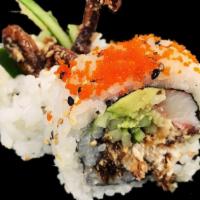 Black Widow Roll · Soft shell crab tempura, crab stick, eel, cucumber and avocado topped with masago and eel sa...