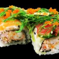 Champion Roll · Shrimp tempura and snow crab topped with salmon, tuna, seaweed salad and masago splashed wit...