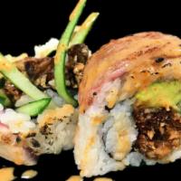 Sneaky Spider Roll · Soft shell crab tempura, cucumber and avocado topped with seared tuna, seared filet mignon a...