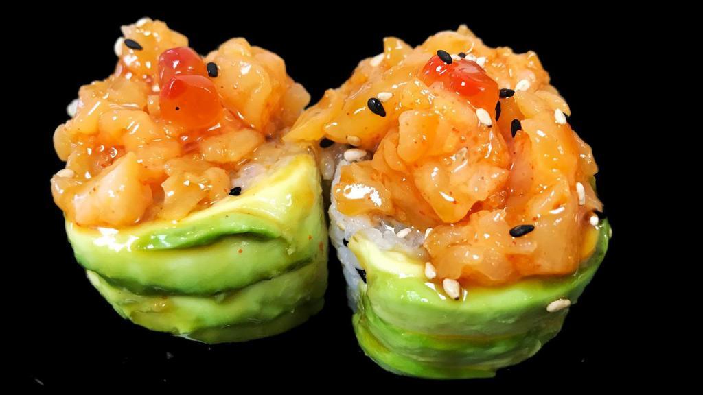 Green Wave Roll · Yellowtail, white fish and tempura flakes wrapped around with avocado topped with chopped scallop mixed spicy mayo and masago decorated with salmon roes.