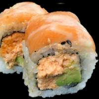 Momo Roll · Spicy scallop and avocado inside topped with salmon and chef's special eel and wasabi sauce.