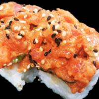 Red Moon Roll · California roll topped with spicy tuna mixed with masago, scallions and spicy mayo.