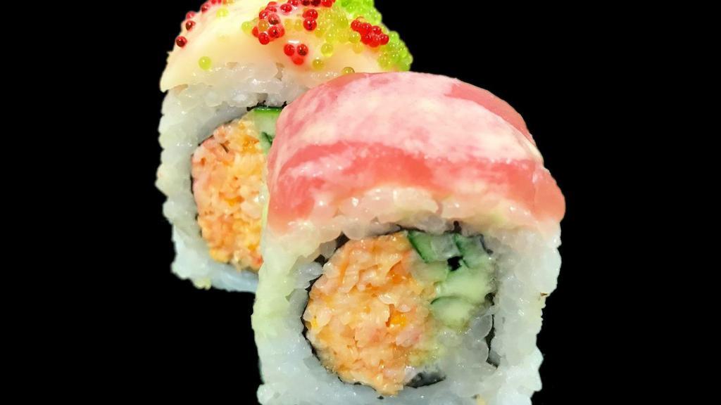 Santa Roll · Spicy crab stick, cucumber and tempura flakes topped with tuna, white tuna, red tobigo, wasabi tobigo and wasabi sauce.