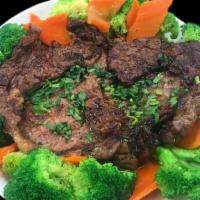 Thai Bbq Beef · Thai style grilled marinated beef served with carrots and broccoli.