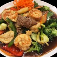 Triple Crown · Beef, chicken, shrimp, broccoli, bell peppers, straw mushrooms, bamboo shoots, carrots tosse...
