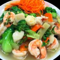 Ocean'S Trio · Shrimp, scallops, lobster meat stir-fried in a Thai white sauce with mushrooms, broccoli, zu...