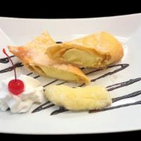 Cheese Cake Xango · Rich smooth cheesecake rolled in melt in your mouth flaky pastry tortilla. Decorated with ch...