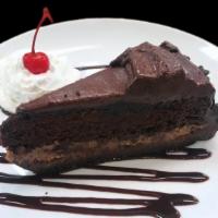 Ultimate Chocolate Cake · Velvety chocolate cake between layers of chocolate decadence and chocolate butter cake on a ...