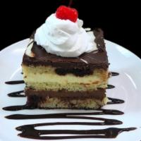 Chocolate Mousse Cake · White and dark chocolate mousse floating between three layers a marble white and dark chocol...