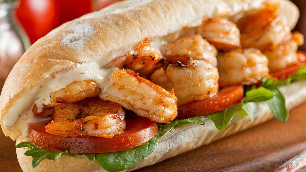 Gulf Caught Wild Shrimp Sandwich · Wild caught gulf shrimp served fried or garlic butter sautéed with lettuce, tomatoes, quitutes sauce and cheese on our housemade French bread.