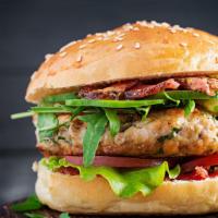 Chicken Bacon Burger · Boneless chicken breast and bacon freshly battered and fried, lettuce, cheese, quitutes sauc...