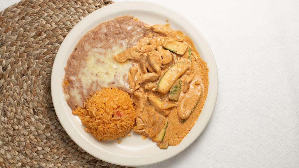Pollo Chipotle #56 · Sliced chicken breast, zucchini, and onions cooked in a creamy chipotle sauce. Served with rice, beans, and tortillas.