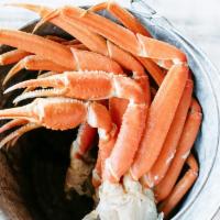Crab Dinner · One pound (two large clusters) of snow crab legs, served with two regular sides, hush-puppie...