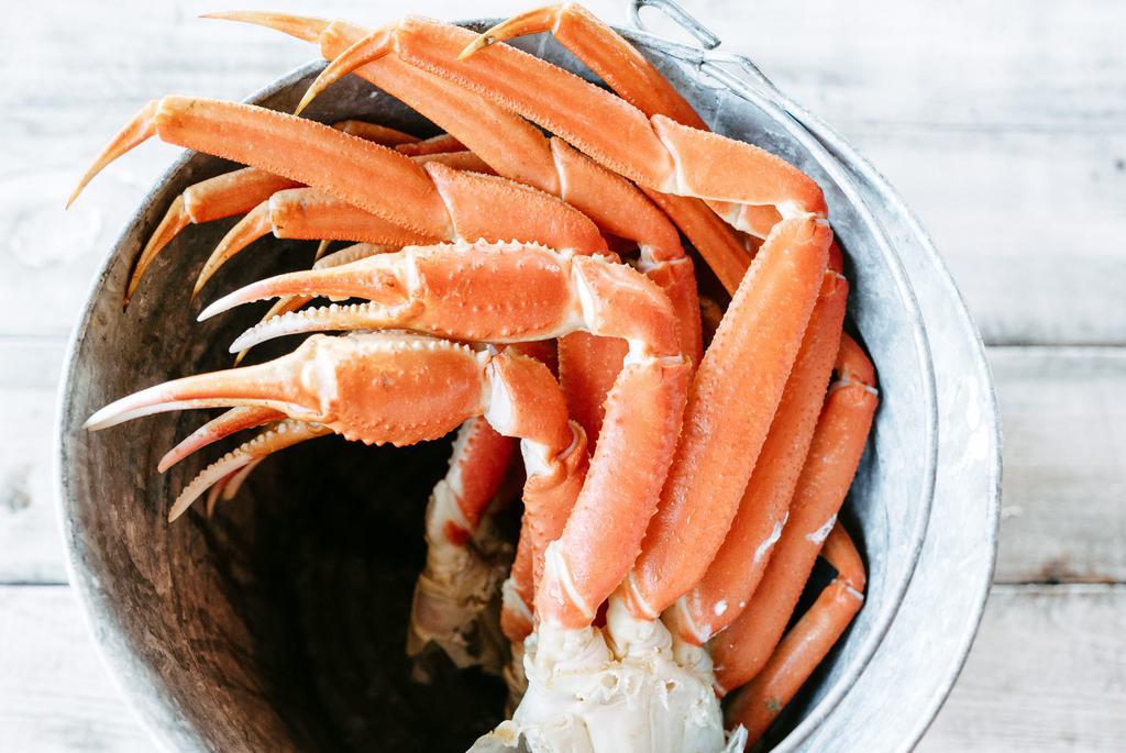 Crab Dinner · One pound (two large clusters) of snow crab legs, served with two regular sides, hush-puppies, and melted butter.