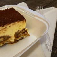 Tiramisu · Sponge cake soaked in brandy, espresso, layered with mascarpone cheese, whipped cream and to...