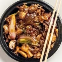 Mongolian Beef · With mushrooms, onions and scallions in sweet soy brown sauce and crispy noodles on bottom.