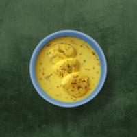 Real Rasmalai · Four pieces. Creamy village cheese patties immersed in chilled flavored milk, topped with ch...