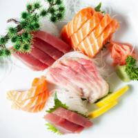 Sashimi Roll · Tuna, salmon, tilapia, crabmeat, avocado in soybean paper.