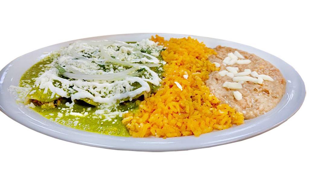 Enchiladas Shredded  Chicken · Green Sauce, shredded chicken with rice and beans & salad.