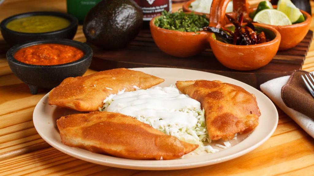 Order 3 Fried Quesadillas · A corn tortilla with mozzarella cheese, stuffed with the meat of your choice and fried in oil. Topped with lettuce, fresh cheese and sour cream