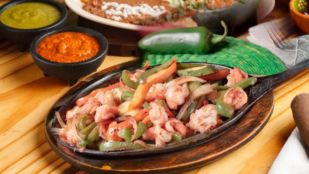 -Fajita De Camaron · Shrimp, chile pepper, tomato, onion. Served with rice and beans lettuce, sour cream, guacamole and pico de gallo.