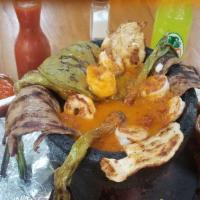 -Molcajete Mixto · Chicken breast, steak, shrimp, Mexican sausage (chorizo), nopal, jalapeno bullied and scalli...
