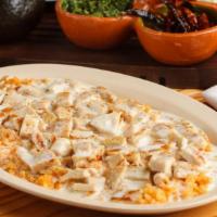 -Arroz Con Pollo Y Cheese Dip · Grilled chicken with rice topped with cheese dip.