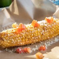 Street Corn · Flash fried, smothered in corn butter, sprinkled with cheese.  Choose from On or Off the cob.