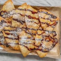 Sopapillas · House fried tortilla triangles, drizzled in our Tipsy-made Mexican & chocolate sauces, duste...