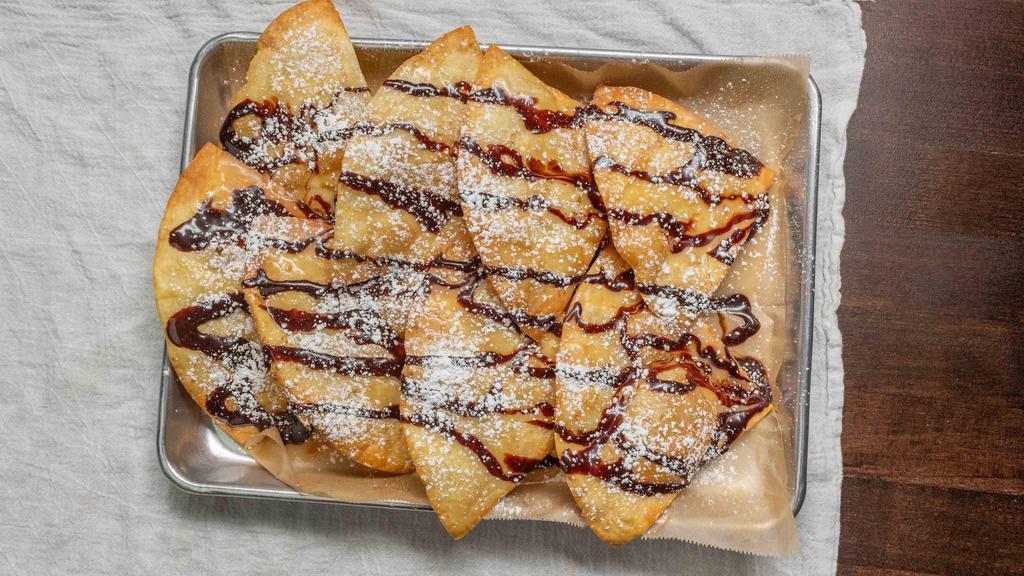 Sopapillas · House fried tortilla triangles, drizzled in our Tipsy-made Mexican & chocolate sauces, dusted with powdered sugar. +Vanilla Ice cream for $2.