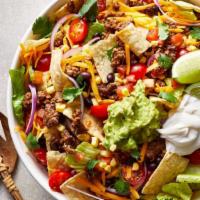 Taco Salad · Crispy flour tortilla shell filled with beef, beans, chicken or beef tips, lettuce, tomatoes...