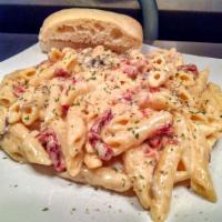 Penne Carbonara · Penne pasta with sautéed sliced fresh mushrooms, bacon, sun-dried tomatoes then tossed in ou...