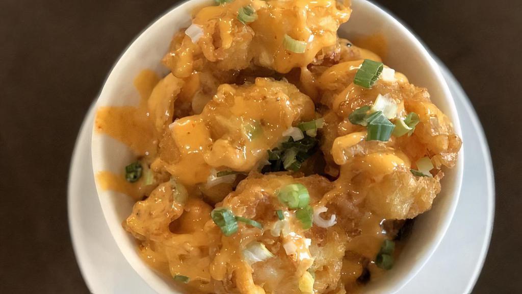 Boom Boom Shrimp · Crispy shrimp, tossed in a creamy sweet chili sauce and green onion.
